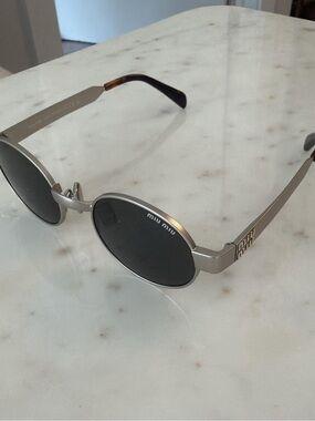 Miu Miu Silver Frame Sunglasses with Black Lenses
